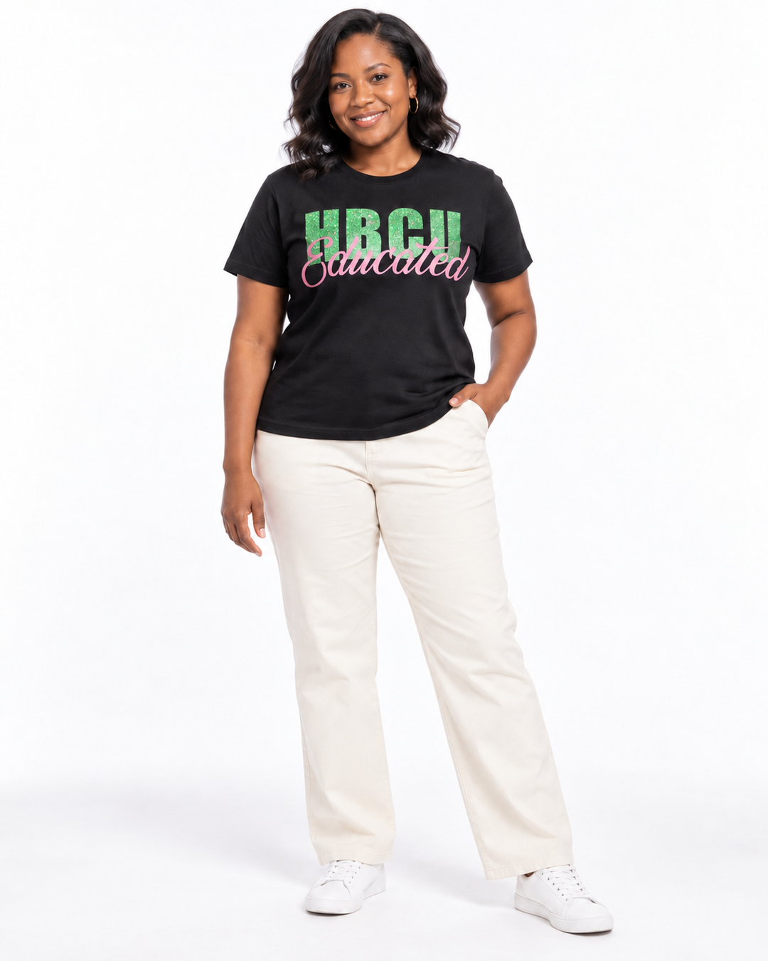 Model wearing a black short-sleeve HBCU Educated Tee with bright green glitter HBCU lettering and matte pink Educated script.